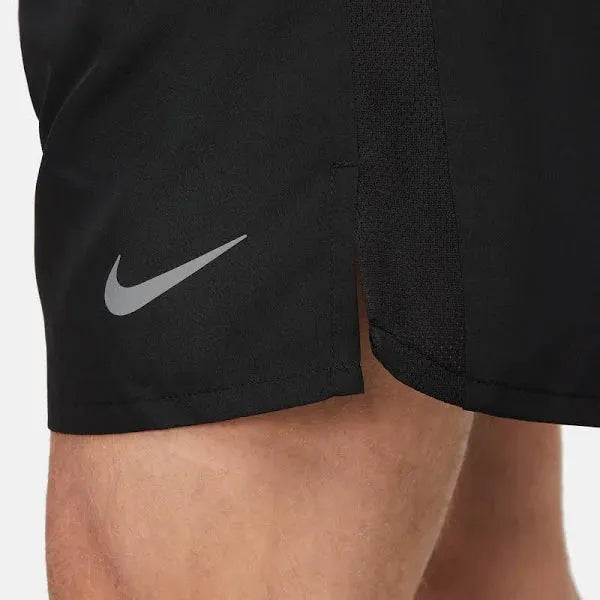 Nike Pocketed Dri-FIT Shorts – close-up of swoosh logo and side split hem detail.