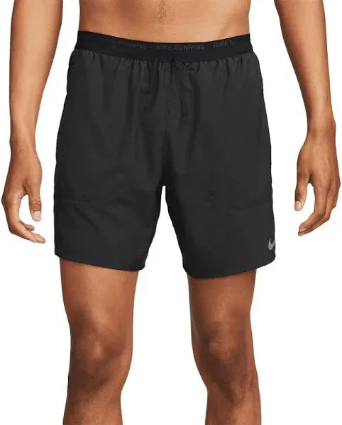 Nike Pocketed Dri-FIT Shorts – close-up of swoosh logo and side split hem detail.