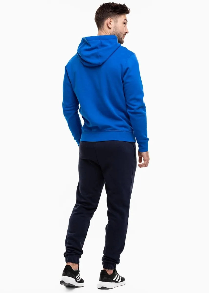  Man walking in Nike Park 20 fleece hoodie royal blue