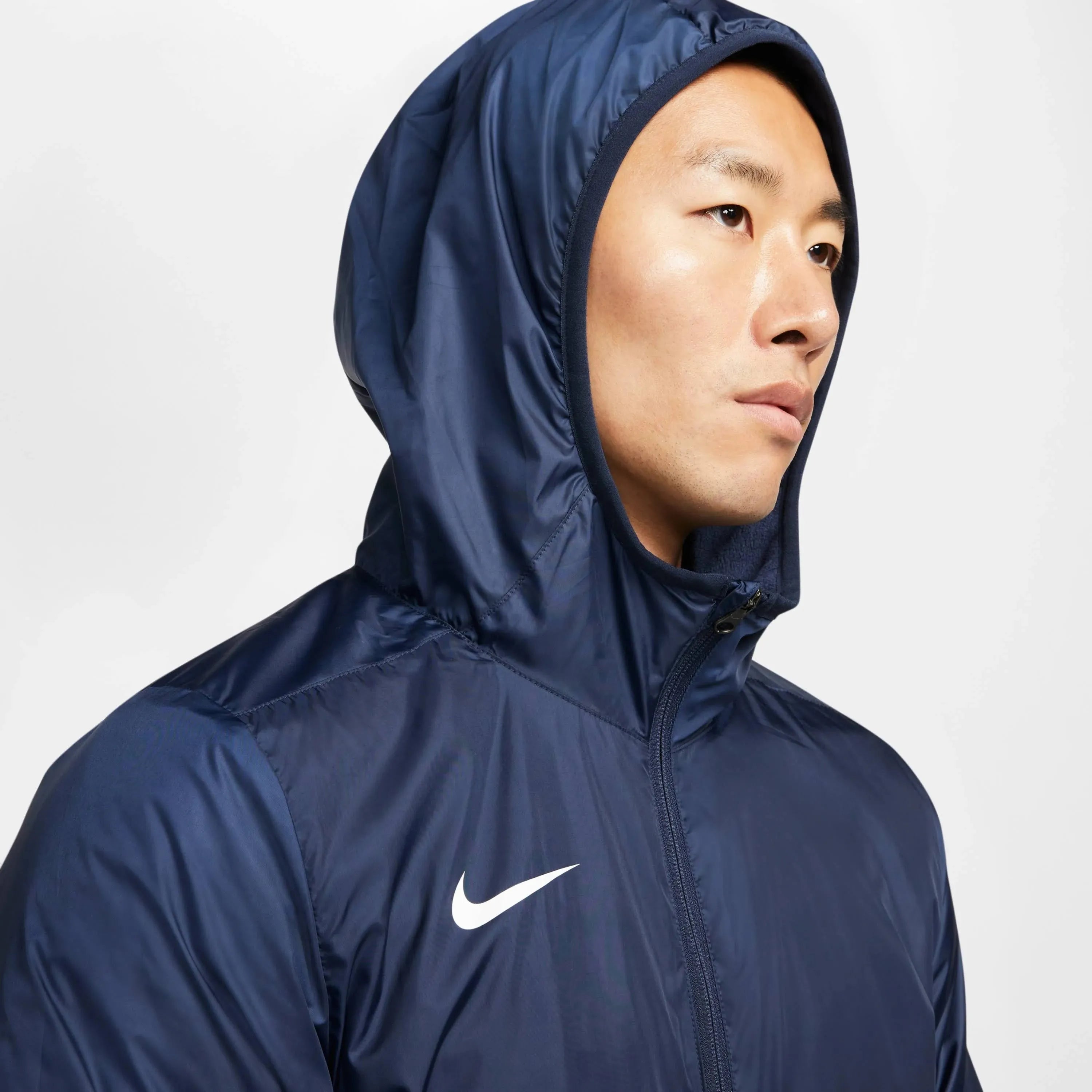 empulse-nike-therma-repel-navy-jacket-hood-on-model-closeup

