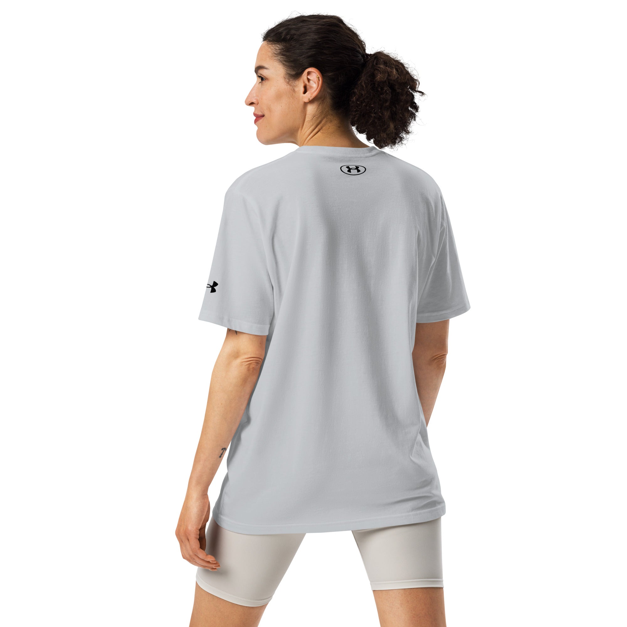 Female model back view in Under Armour Running Division Tee with long fit
