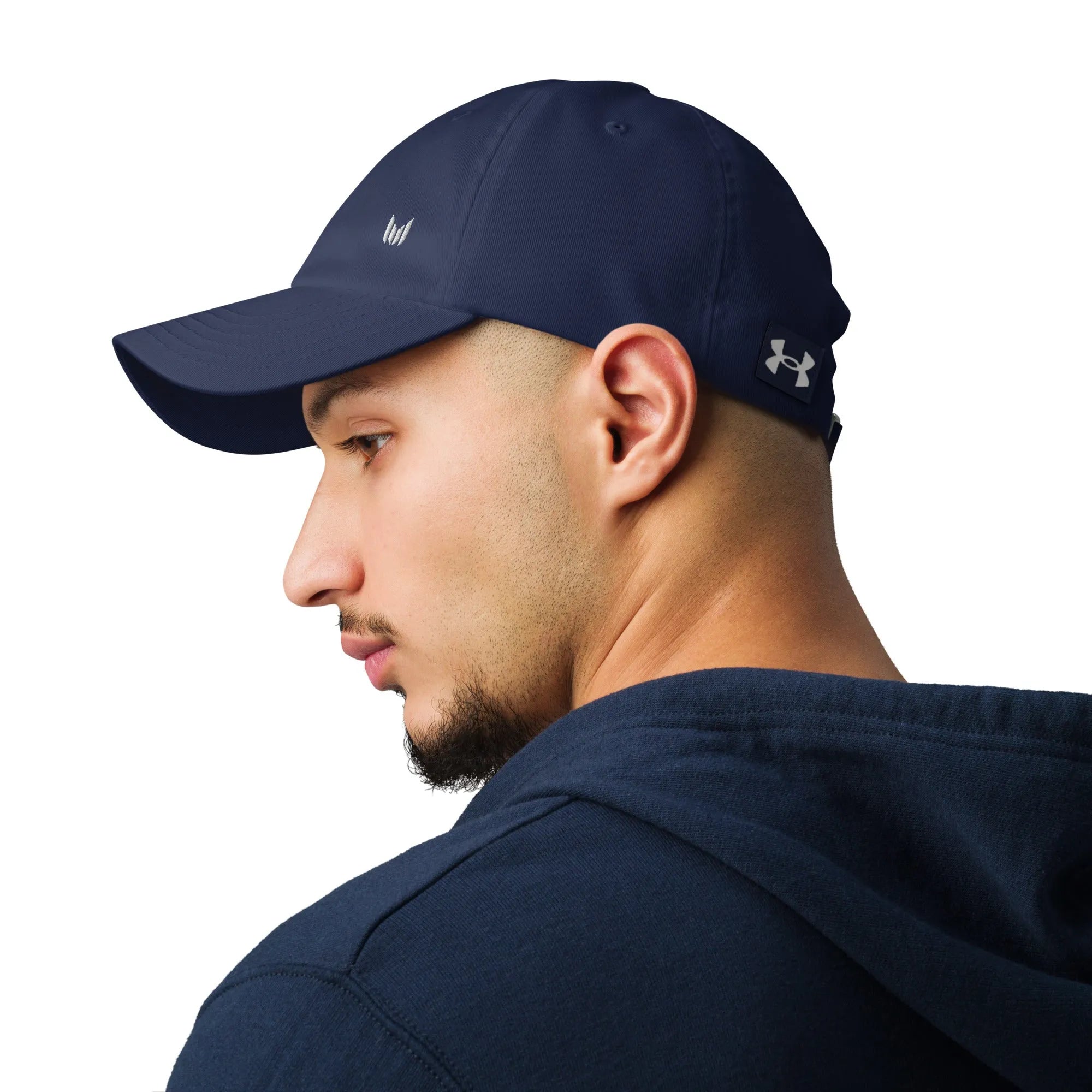 Side view of navy Under Armour hat worn with navy hoodie