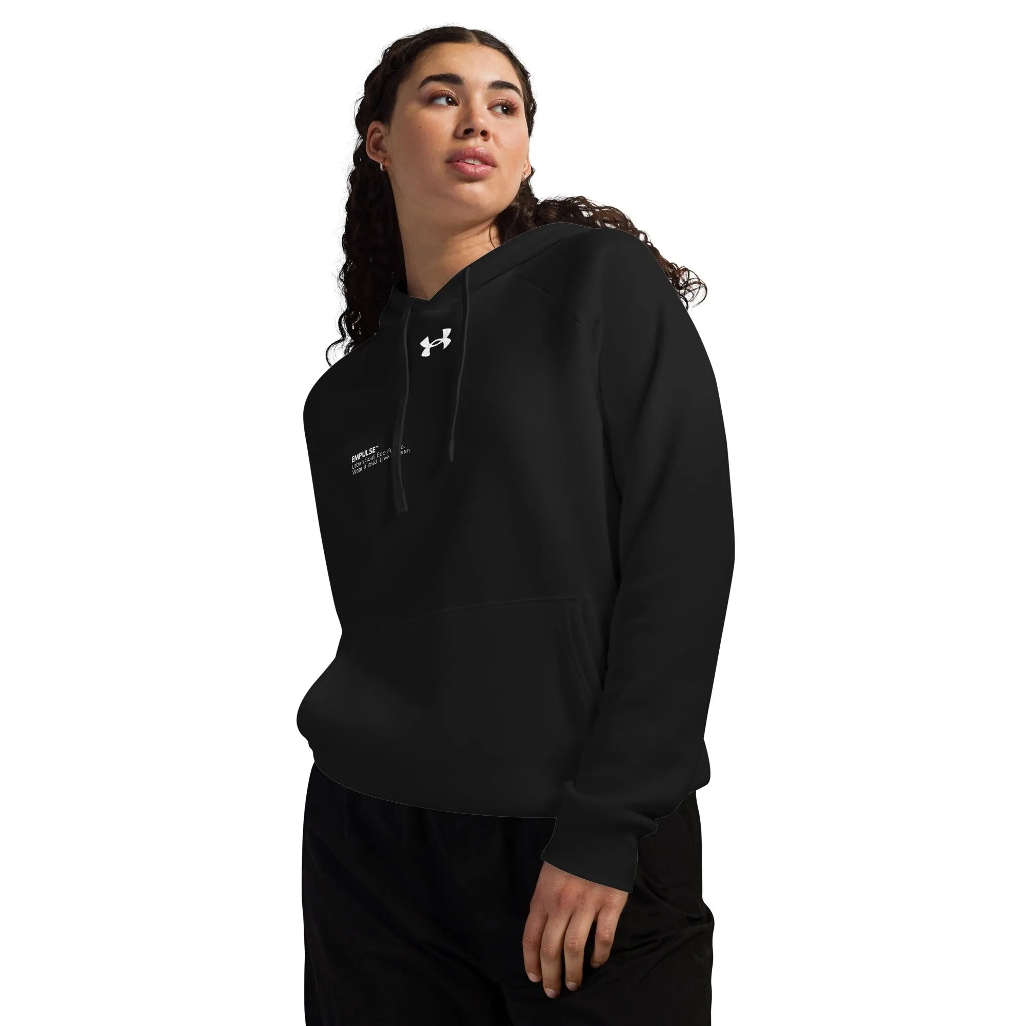 Black Under Armour hoodie worn by female model in relaxed stance side view
