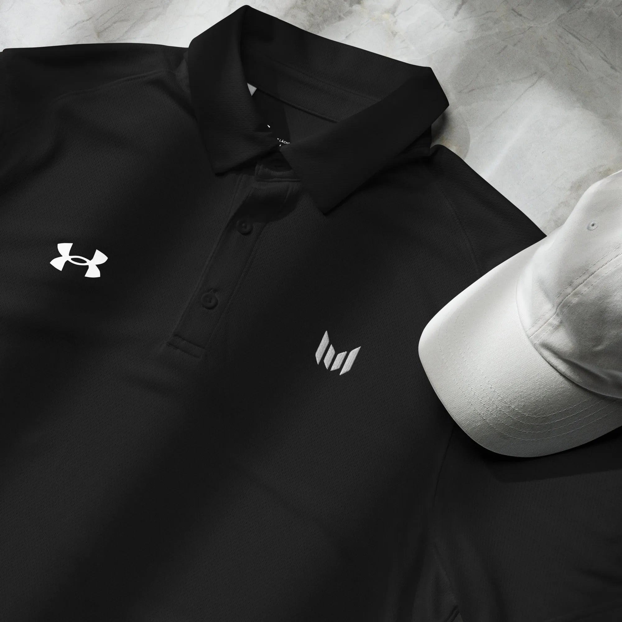 Close-up of Under Armour men's polo showing logo and fabric detail