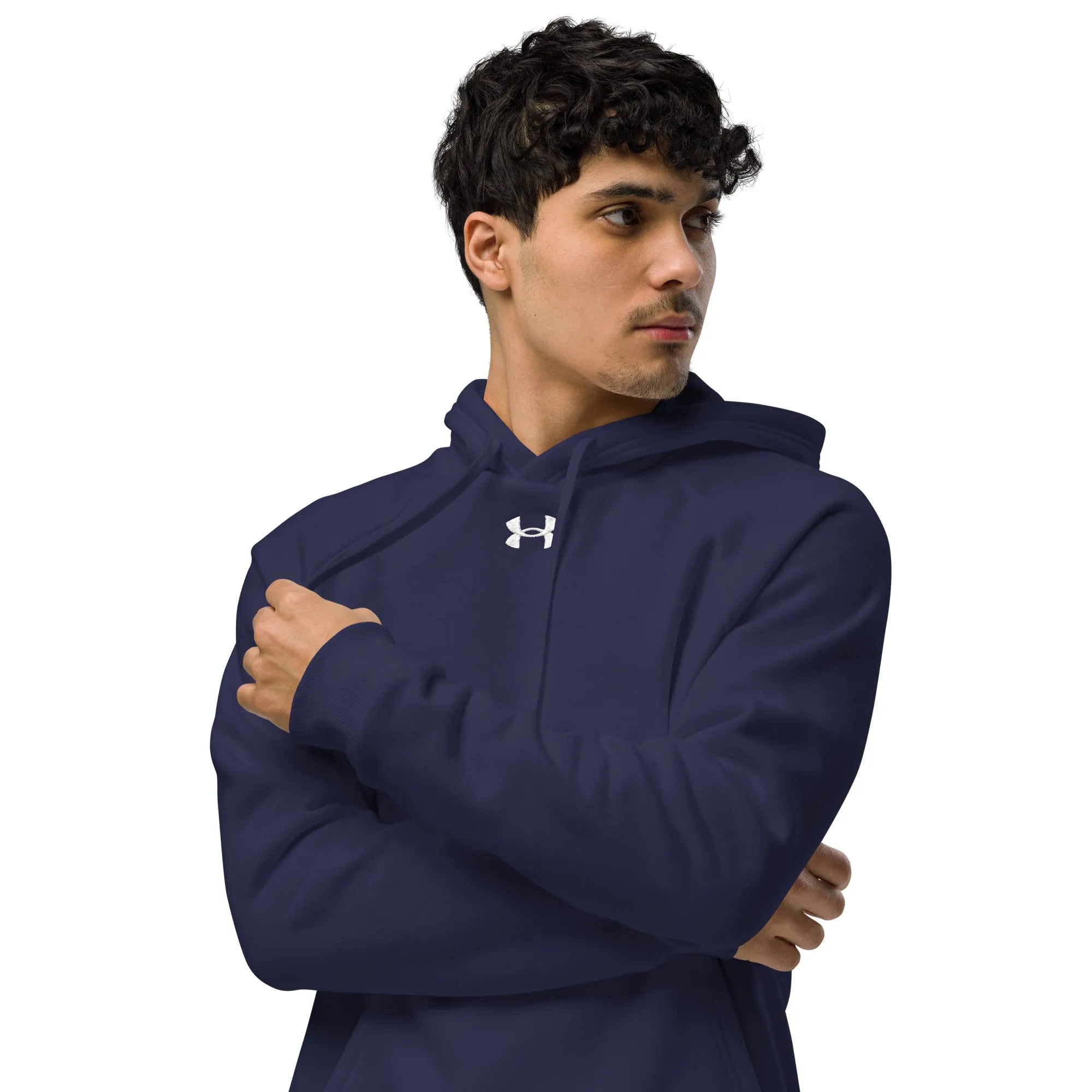 Navy Under Armour hoodie worn by male model with arms crossed