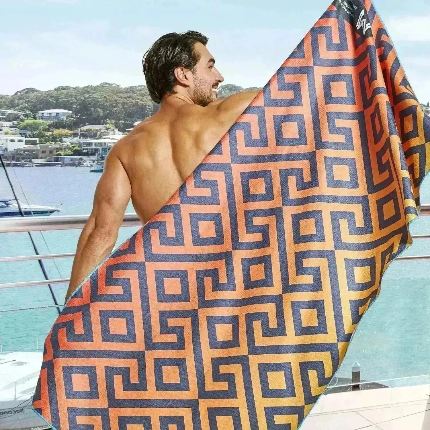 Closeup of folded Vibrant Canopy towel showing bright pattern and corner finish